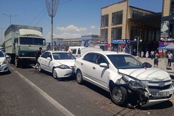A truck collided with four passenger cars