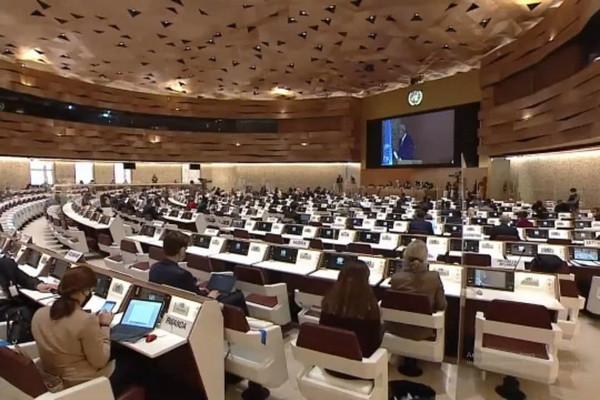 Akmal Saidov makes a report at the session of the UNHRC in Geneva