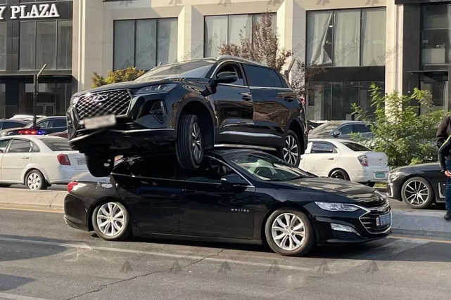 Chery Ends Up on Top of Malibu After Collision In Tashkent