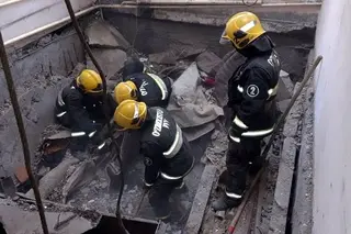 Girl and body of a men found in the rubble in the house in Nukus