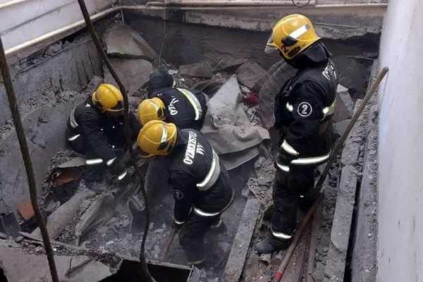 Girl and body of a men found in the rubble in the house in Nukus