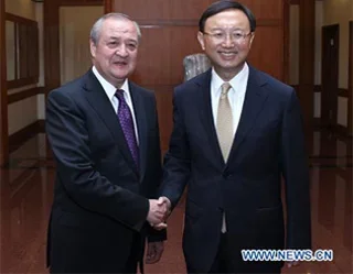 Chinese FM meets Uzbekistani counterpart