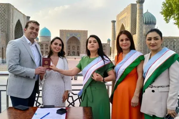 A couple from the United States get married on Registan Square