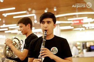 Surprise musical flashmob by music.glier boyband delights travelers at Tashkent Airport