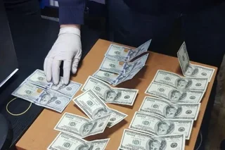 Law enforcement officers prevent the illegal export of a large amount of foreign currency from the country